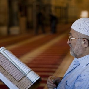 Palestinian Muslim Reading The Holy Qur'an In Al Aqsa Mosque